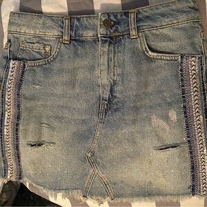 Free People size 6 denim skirt with cool stripe accent down the sides.